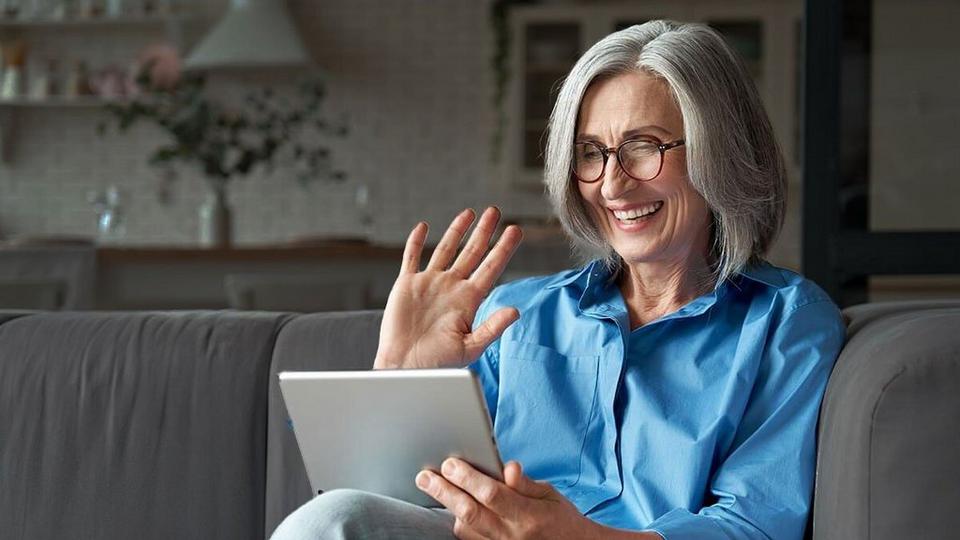 Mother-on-sofa-with-tablet-DARKER